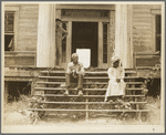 Ex-slave and wife on steps of plantation house now in decay. Greene County, Georgia