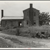 A plantation house decaying and now vacant but for two rooms occupied by an old couple, Negro tenants. Greene County, Georgia