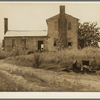 A plantation house decaying and now vacant but for two rooms occupied by an old couple, Negro tenants. Greene County, Georgia