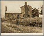 A plantation house decaying and now vacant but for two rooms occupied by an old couple, Negro tenants. Greene County, Georgia