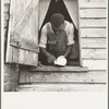 Negro field hand getting ready to go to town on a Saturday afternoon. His wages are seventy-five cents a day and cabin. He has six children [Greene County, Georgia]