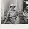 One of a group of western Oklahoma wheat farmers congregated at crossroads service station. "In 1934 I had four renters, and I didn't make anything. I bought tractors on the money the government give me, and I got shet of my renters"