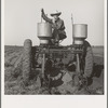 Tractor operator in western cotton fields. Works as wage laborer, earns one dollar per day. Childress County, Texas