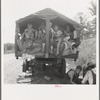 On highway no. 1 of the "OK" state near Webbers Falls, Muskogee County, Oklahoma. Seven children and eldest son's family. Father was a blacksmith in Paris, Arkansas. Son was a tenant farmer