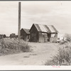 Home of agricultural workers in Arizona. Two families live in this house. They have been in Arizona for six months. Before that they worked in south Texas, picking cotton