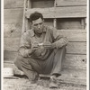 Native Texan farmer on relief. Goodliet [sic], Hardeman County, Texas. "Tractored out" in late 1937. Now living in town, and on the verge of relief. Wife and two children