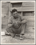 Native Texan farmer on relief. Goodliet [sic], Hardeman County, Texas. "Tractored out" in late 1937. Now living in town, and on the verge of relief. Wife and two children