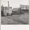 Squatter camp on the flat where families live during the orange picking season. Near Porterville, California