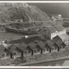 Lumber industry of the California north coast. Abandoned lumber town showing mill and houses. Mendocino County, California