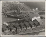 Lumber industry of the California north coast. Abandoned lumber town showing mill and houses. Mendocino County, California