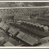 Lumber industry of the California north coast. Abandoned lumber town showing mill and houses. Mendocino County, California
