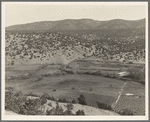 Outlying fields of Mexican village in the hills of the Tewa Basin, New Mexico