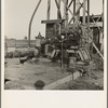 This pumping plant for irrigation is powered by a natural gas engine which operates on cost of about 1/2 the cost of electricity, Tulare County, California