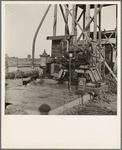 This pumping plant for irrigation is powered by a natural gas engine which operates on cost of about 1/2 the cost of electricity, Tulare County, California
