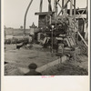 This pumping plant for irrigation is powered by a natural gas engine which operates on cost of about 1/2 the cost of electricity, Tulare County, California