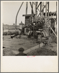 This pumping plant for irrigation is powered by a natural gas engine which operates on cost of about 1/2 the cost of electricity, Tulare County, California
