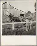 Farm Security Administration rural rehabilitation client, Tulare County, California, consulting with county supervisor. He and his family of seven were on relief. He had lost his arm on a construction project