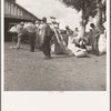 Migratory cotton pickers on small cotton farm, Kern County, California. They are paid senty-five cents per one hundred pounds of picked cotton