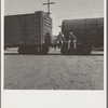 Colored itinerants on oil tank cars passing through Kingsbury, California