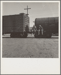 Colored itinerants on oil tank cars passing through Kingsbury, California