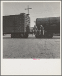 Colored itinerants on oil tank cars passing through Kingsbury, California