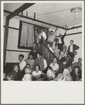 Listening to the speaker at the Conference to Aid Agricultural Organization during the cotton strike (Steinbeck Committee). Bakersfield, Kern County, California