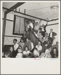 Listening to the speaker at the Conference to Aid Agricultural Organization during the cotton strike (Steinbeck Committee). Bakersfield, Kern County, California