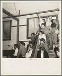Listening to the speaker at the Conference to Aid Agricultural Organization during the cotton strike (Steinbeck Committee). Bakersfield, Kern County, California