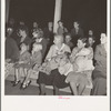 Mothers on the sidelines, watching the Halloween party. Shafter migrant camp, California