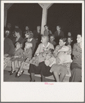 Mothers on the sidelines, watching the Halloween party. Shafter migrant camp, California