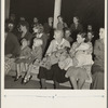 Mothers on the sidelines, watching the Halloween party. Shafter migrant camp, California