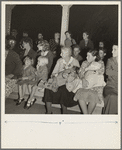 Mothers on the sidelines, watching the Halloween party. Shafter migrant camp, California