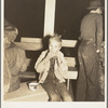 Hungry boy at the Halloween party for migrant workers. Shafter migrant camp, California