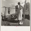 Women in auto camp for migrant citrus workers. Tulare County, California