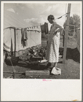 Women in auto camp for migrant citrus workers. Tulare County, California