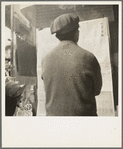 San Francisco Chinaman reading news of surrender of Canton to Japanese. San Francisco, California