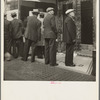 In front of the local paper of San Francisco's Chinatown Chinese read news of the surrender of Canton to the Japanese. Most of San Francisco's Chinese are Cantonese