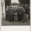 In front of the local paper of San Francisco's Chinatown Chinese read news of the surrender of Canton to the Japanese. Most of San Francisco's Chinese are Cantonese