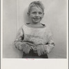 Migrant cotton picker's child who lives in a tent in the government camp instead of along the highway or in a ditch bank. Shafter Camp for migrants, California