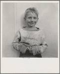 Migrant cotton picker's child who lives in a tent in the government camp instead of along the highway or in a ditch bank. Shafter Camp for migrants, California