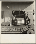 Weighing baled cotton as it leaves the gin. Kaweah Delta Cooperative gin, Tulare County, California