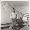 Migrant cotton picker's child who lives in a tent in the government camp instead of along the highway or in a ditch bank. Shafter Camp for migrants, California