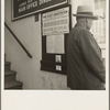 The street entrance to the Farm Security Administration office, Visalia, Tulare County, California. This farmer has come into town to discuss problems with the rural rehabilitation supervisor