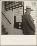 The street entrance to the Farm Security Administration office, Visalia, Tulare County, California. This farmer has come into town to discuss problems with the rural rehabilitation supervisor
