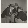 Camp manager, migratory worker, and visitor to the camp in discussion. Shafter camp for migrants, California