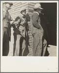 Destitute farm families come to FSA (Farm Security Administration) distributing depot to apply for food grant. Bakersfield, Kern County, California