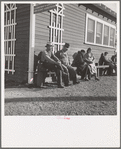 Lineup outside of Farm Security Administration grant office (relief to farm laborers) early in the morning, before the office has opened. Tulare, California