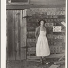 Farm woman beside her barn door. Tulare County, California. No more horseshoes!