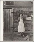 Farm woman beside her barn door. Tulare County, California. No more horseshoes!