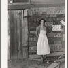 Farm woman beside her barn door. Tulare County, California. No more horseshoes!